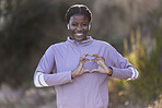 Black woman, fitness and hands in heart gesture, sign or symbol in love for healthy cardio, exercise or workout in nature. Portrait of African American female showing hearty shape hand for wellness