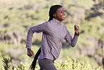 Fitness, nature and profile of black woman running in countryside, woods or forest for body goals, cardio health or wellness. Exercise, workout and happy African runner training for marathon race