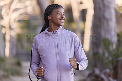 Buy stock photo Fitness, running and black woman smile on a sport run in forest park outdoor with happiness. Happy, African and exercise runner feeling freedom from cardio, marathon training and motivation in nature
