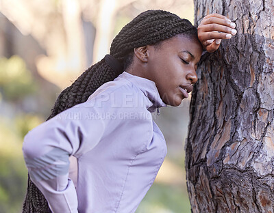 Buy stock photo Fitness, forest and tired black woman with tree for support with marathon competition training, workout or mental health sports. Burnout, fatigue or back pain of African athlete for exercise in woods