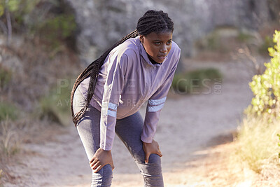 Buy stock photo Fitness, mountain and black woman tired from running, marathon training and exercise in nature. Wellness, endurance and female athlete taking a break, rest and breathe to relax after sports workout