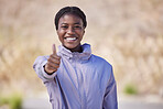 Portrait, thumbs up and black woman outdoor, training and exercise for fitness, power and wellness. Young female Nigerian, athlete and healthy girl with hand gesture for achievement, goals or workout