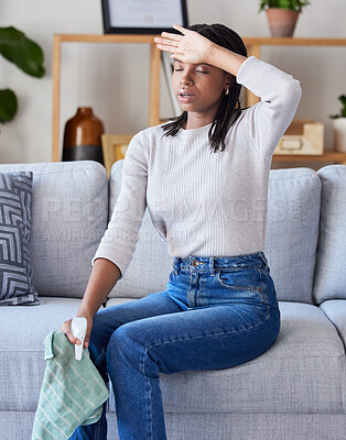 Buy stock photo Headache, cleaning woman and tired person at home after spring clean and living room dust. House, black woman and sad cleaner feeling stress and sad from spring cleaning with spray and cloth on sofa