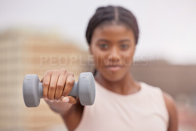 Buy stock photo Fitness, dumbbell or black woman in a city training, workout or arm exercise for strong muscles or growth. Blurry, motivation or healthy African girl exercising for body development on a rooftop