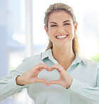 Portrait, woman and heart sign with smile, support and relax for wellness, success and ceo. Female, entrepreneur and lady with hand gesture for love, happiness and confident for solidarity and peace.