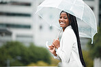 Fashion, umbrella and city with a walking black woman in the street during a cold rain or wet winter day. Water, portrait and cover with a young female outdoor for a walk in an urban town or New york