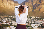 Fitness, mountain and woman doing a stretching exercise before a wellness workout in nature. Sports, outdoor and lady athlete doing a warm up before training or exercising on a rooftop in the city.