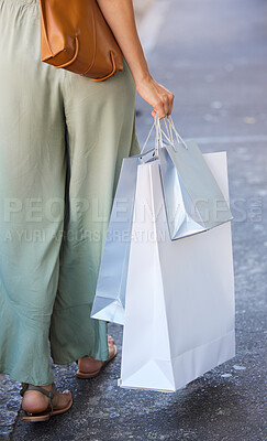 Buy stock photo Back of woman, fashion and shopping bag in city after buying clothing at luxury mall. Black Friday discount, sales deals and female with gifts in street after purchase at retail store or boutique.