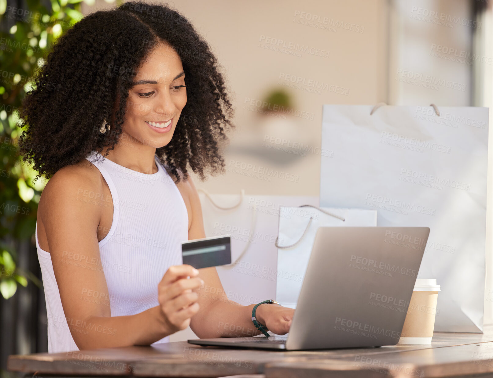 Buy stock photo Black woman, laptop and credit card for ecommerce, online shopping and making payment with fintech software while at a cafe with wifi connection. Female customer in Paris doing internet banking