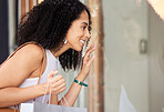 Window shopping, black woman and shopping mall store with a customer looking at sale and discount. Retail shop, sales and luxury boutique windows with a person happy with shopping bag and smile