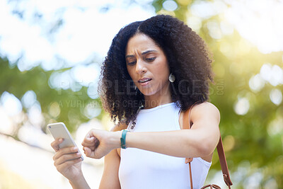 Buy stock photo Black woman, phone and checking time on watch for schedule, appointment or planning in the park. African American female monitoring smart watch for busy day in the outdoors with smartphone in nature