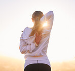 Fitness, stretching and woman exercise at sunset for training, wellness and running in nature, rear view and body preparation. Exercise, stretch and girl runner getting ready for workout at sunrise 