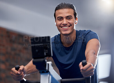 Buy stock photo Man, fitness and cycling at the gym for exercise, workout or healthy cardio training. Portrait, happy smile or exercising on stationary bicycle or bike machine for health, wellness or endurance sport
