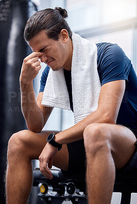 Buy stock photo Man, gym exercise and tired with headache at training, workout or wellness studio with anxiety. Bodybuilder, fitness and burnout while sitting for stress, rest or relax after weightlifting in Toronto