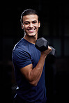 Bodybuilder man, studio portrait and weightlifting with smile for fitness, muscle development and health. Happy bodybuilding athlete, dumbbell and black background for workout, training and self care