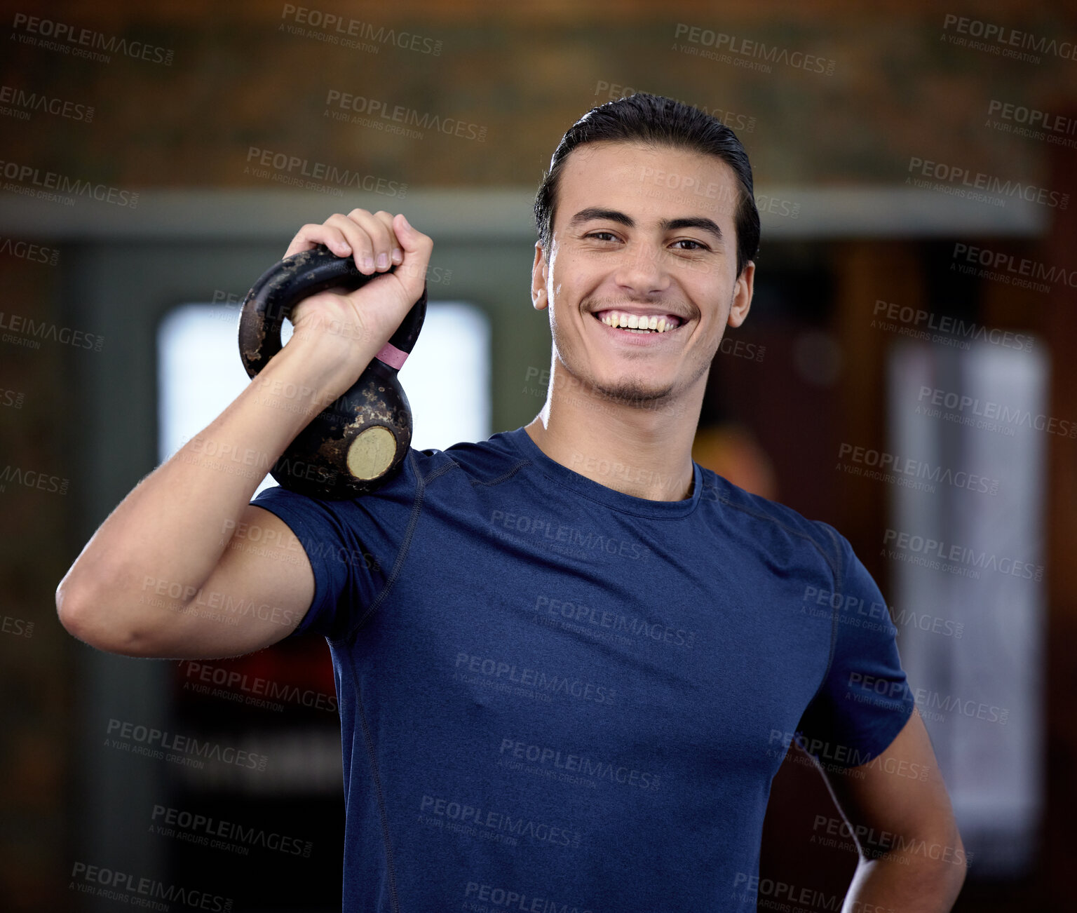 Buy stock photo Fitness, portrait or man at gym with a kettlebell for strong arms or training biceps in workout or weightlifting exercise. Smile, face or happy personal trainer ready for coaching with wellness goals
