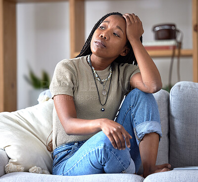 Buy stock photo Black woman, sofa and stress with worry, thinking and sad in home living room with fear of future. African woman, sitting and lounge couch with anxiety, depression or mental health problem in Chicago