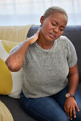 Buy stock photo Stress, neck pain and tired black woman on sofa with injury in living room of apartment. Burnout, muscle pain and anxiety, woman with headache from being overworked and exhausted on couch in home.