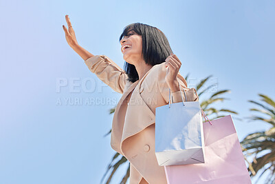 Buy stock photo Sky, bag and woman wave after shopping for retail fashion deal, discount sales product or luxury designer clothes. Hawaii palm trees, market choice and customer with gift from mall store bottom view