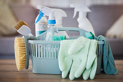 Buy stock photo Cleaning, products and basket on table in home living room for spring cleaning. Hygiene, cleaning supplies and housekeeping equipment for disinfecting, sanitizing or removing germs, bacteria or dust.