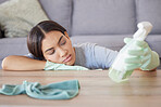 Detergent, housekeeping and woman tired from cleaning furniture, counter and table in apartment living room. Housework, domestic chores and exhausted woman with spray bottle cleaning products in hand