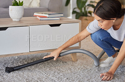 Buy stock photo Woman, cleaning and vacuum machine for carpet in house, home or hotel living room in hygiene maintenance or housekeeping. Maid, cleaner service or worker with suction on floor rug for spring cleaning