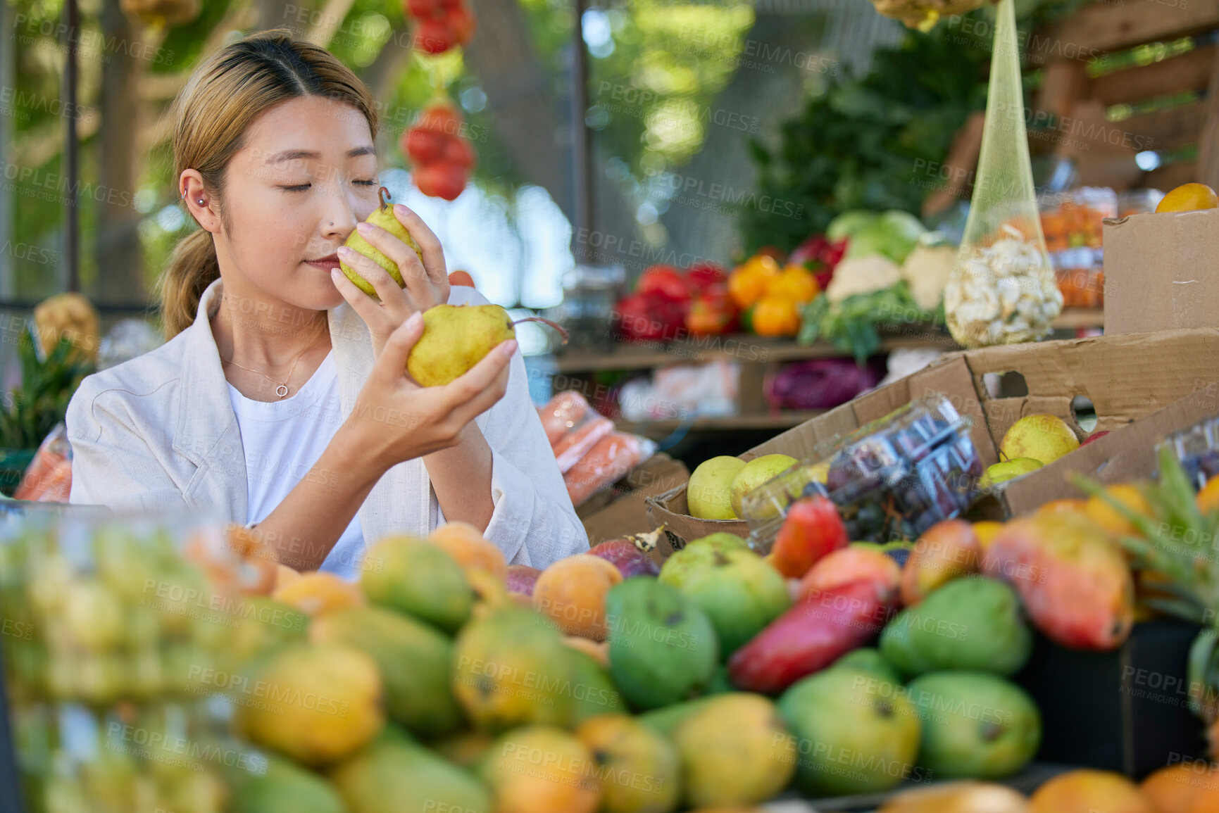 Buy stock photo Fruits, food and woman in Japan market for quality choice, nutrition and healthy shopping in green, eco friendly store. Outdoor marketplace, pear and vegan asian or customer sale, offer and discount