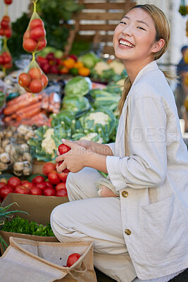 Buy stock photo Asian woman, supermarket and grocery shopping and tomato, customer and retail, vegetable fresh product and buying food at store. Young happy female and smile, sale and discount on groceries at market
