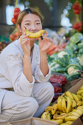 Buy stock photo Asian woman, portrait and fruit or vegetable market outdoor for grocery shopping, food supermarket and happy customer with banana. Nutrition, grocery store fruits and happiness for healthy eating 