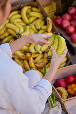 Buy stock photo Banana, hands and woman with shopping in marketplace, outdoor and fresh, organic and healthy fruit and vegetables. Grocery shopping, market and customer choice of food, diet and nutrition with fruits