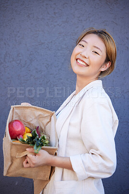 Buy stock photo Woman, face or grocery basket with organic fruit, healthy food or Japanese diet produce on blue background with mockup advertising space. Portrait, smile or happy customer with supermarket vegetables