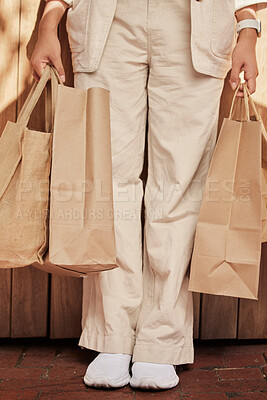 Buy stock photo Sustainability, fashion paper bag and woman legs for eco friendly, vegan and designer retail clothes in shopping, commerce and economy. Sustainable market, sale and discount of customer bag in hands
