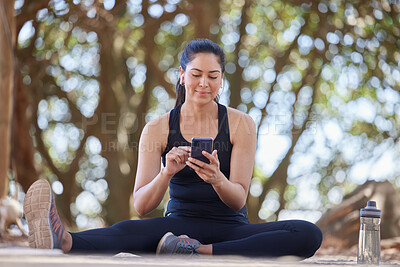 Buy stock photo Fitness, relax and woman in park with phone on break after running, exercise and workout in nature. Sports, wellness and happy girl on smartphone for training blog, health mobile app and social media