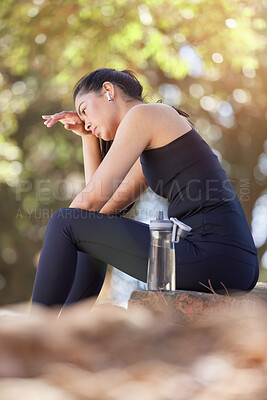 Buy stock photo Nature, hiking and woman on water break sitting on rock in forest to relax on run or workout. Health, fitness and wellness, a tired girl on hike rest with drinking water bottle on adventure path.