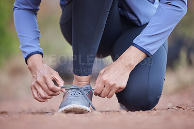 Buy stock photo Start, running and feet of a woman in nature, training motivation and cardio fitness in Colombia. Ready, shoes and hands of an athlete tying laces for workout, exercise or hiking in a park for health