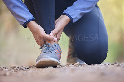 Buy stock photo Running, ankle pain and injury with shoes of black woman on nature trail for training, jogging and endurance. Sprain, accident and broken with girl runner on path for workout, exercise and sports