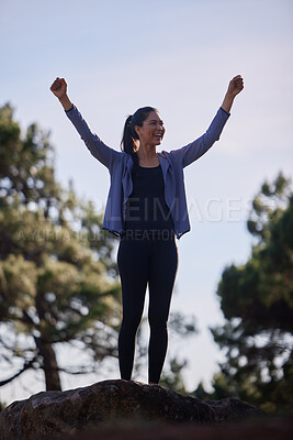 Buy stock photo Fitness, winner and mountain with woman celebrate hiking goal, marathon training and target with success hands sign on a blue sky. Sports, athlete and runner on hill in forest winning triathlon event