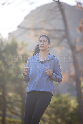 Buy stock photo Woman, running and runner on nature run in forest for healthy fitness exercise, outdoors cardiovascular workout and sports training. Jog in green woods, natural trees and motivation for cardio health