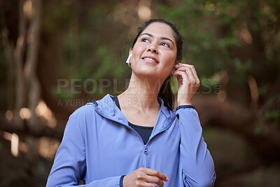 Buy stock photo Forest, fitness and woman listening to music for nature calm, peace and zen podcast with inspiration for sports training, hiking or running. Happy woman or athlete with audio technology in the woods 