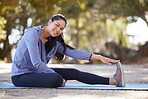 Woman portrait, stretching and fitness training, exercise and workout on mat outdoor with happy smile. Young female, body warmup and stretch leg. in nature for health, wellness and healthy lifestyle