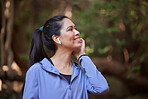 Woman, music earphones and hiking in nature woods, countryside forest or park environment in healthcare wellness or fitness. Smile, happy and relax hiker listening to radio, sports or workout podcast