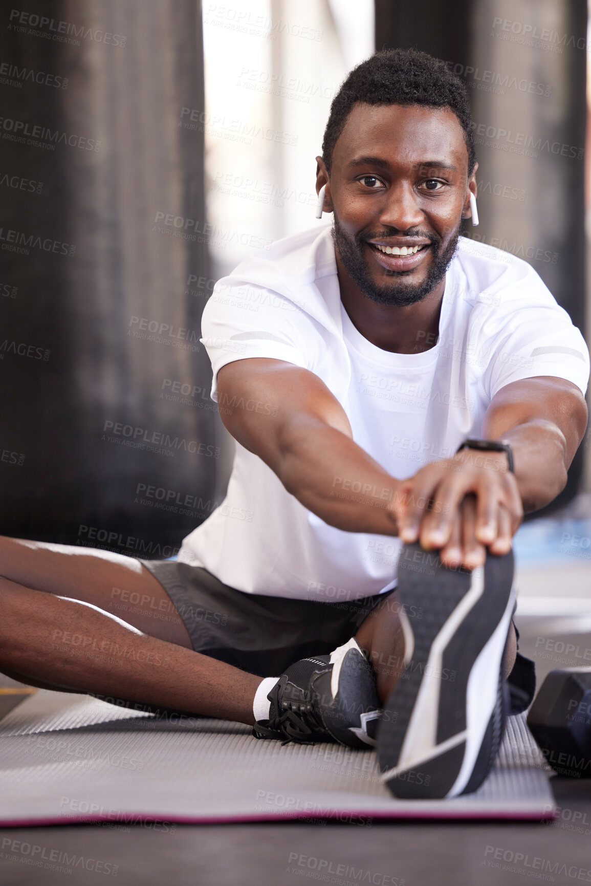 Buy stock photo Fitness, stretching and portrait of black man in gym for exercise, workout and training with earphones. Sports, healthy lifestyle and male athlete getting ready, warm up and stretch legs on floor