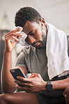Black man, phone and sweat for relax fitness or typing sports communication online, exercise training and runner workout. Cardio wellness, run motivation rest or athlete reading on smartphone in gym