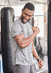 Fitness, gym and excited black man with muscle after workout, bodybuilder training and boxing exercise. Sports, power and strong male athlete flex biceps for muscular body, goals and achievement