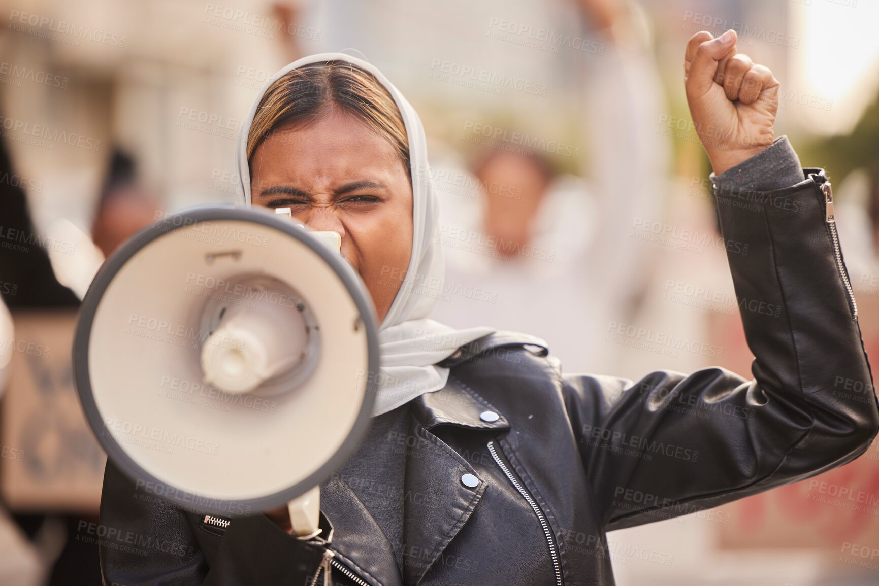 Buy stock photo Freedom, megaphone and fist with muslim woman in protest for support, social justice and human rights activist. Politics, revolution and equality with hijab girl in crowd for discrimination fight