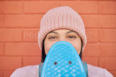 Buy stock photo Woman, face or skateboard on orange wall background in city in fashion, Brazil trendy or cool clothing, hat or beanie head wear. Portrait, happy or skateboarder student or freedom vision or fun ideas