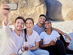 Friends, selfie and beach for a picnic, drinks and happiness with couple on double date and online for social media update. Diversity men and women with phone on ocean sand for fun, love and bonding