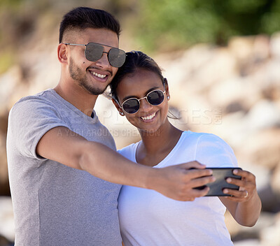 Buy stock photo Couple, smile and selfie on summer vacation, holiday and travel adventure together with love, care and happiness. Happy couple, man and woman with sunglasses taking mobile photo outdoor for memory 