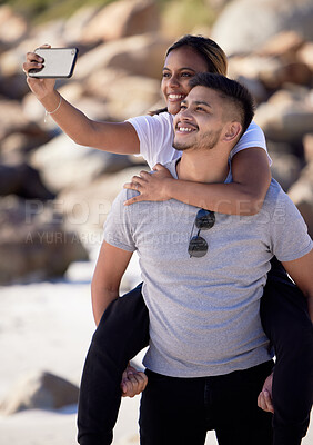 Buy stock photo Beach, selfie and piggy back couple, smile with smartphone on romantic summer holiday at ocean. Romance, man and woman at with phone, love and vacation time for happy couple together in Australia.
