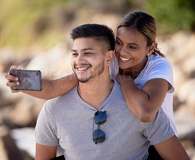 Buy stock photo Couple selfie, outdoor nature and hug with smile, care or love by blurred background in sunshine. Man, black woman and smartphone for digital picture with happiness for social media while hiking